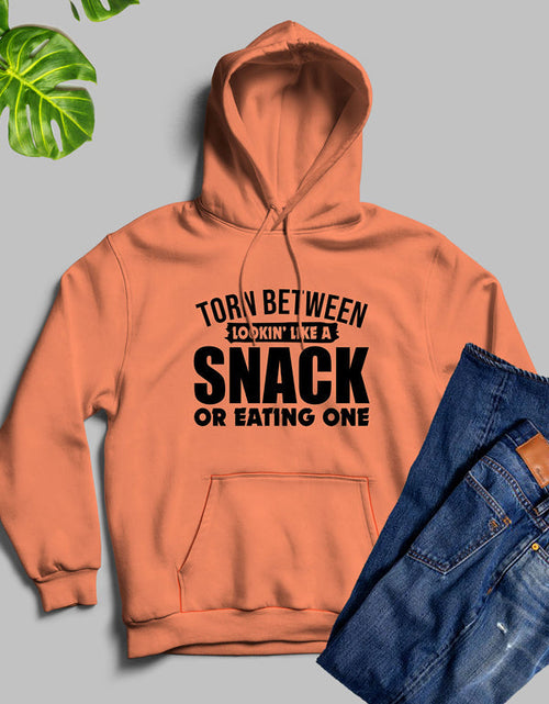 Load image into Gallery viewer, Torn Between Lookin Like A Snack Or Eating One Hoodie
